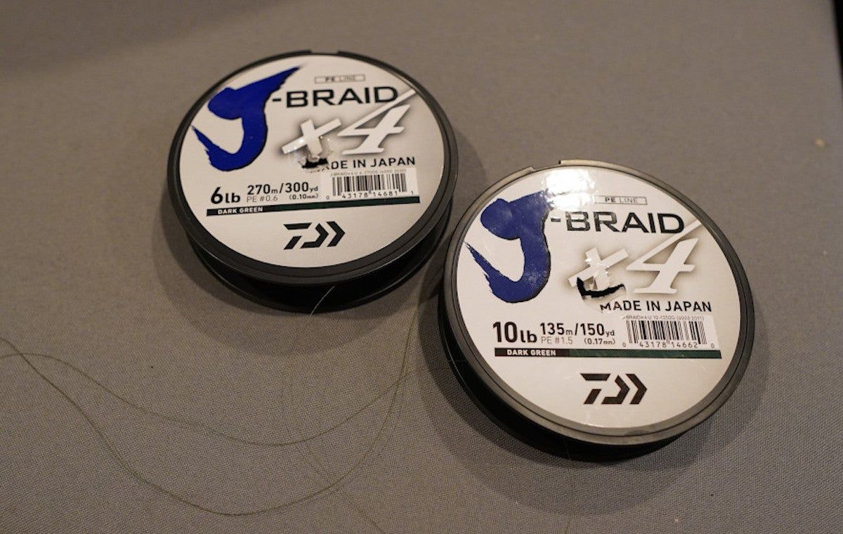 Daiwa J-Braid fishing line spools sitting on table during testing