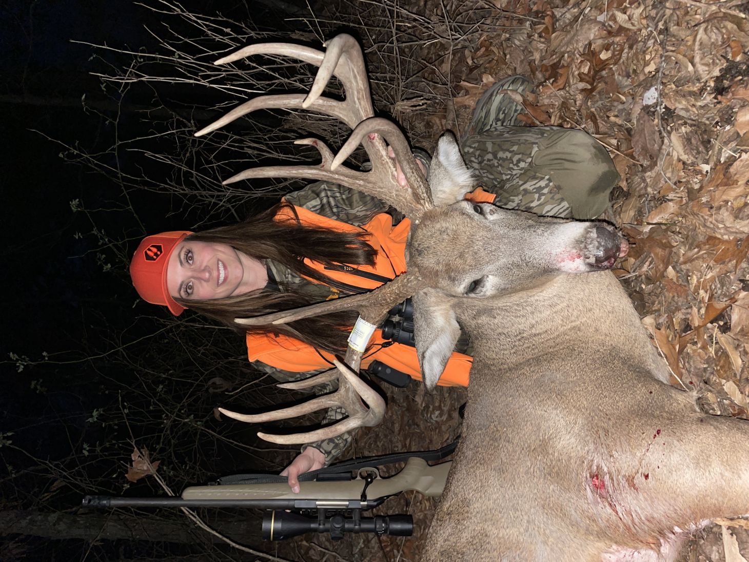 TV host Dawn Jensen poses with a huge whitetail buck taken with a rifle. 