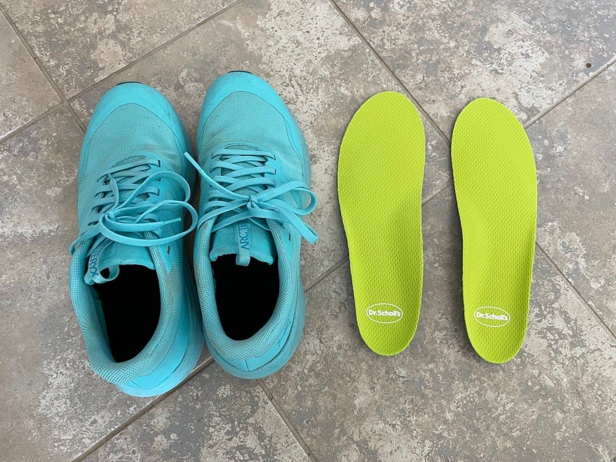 Dr. Scholl's Sport & Fitness All-Purpose Comfort Insoles sitting next to hiking shoes