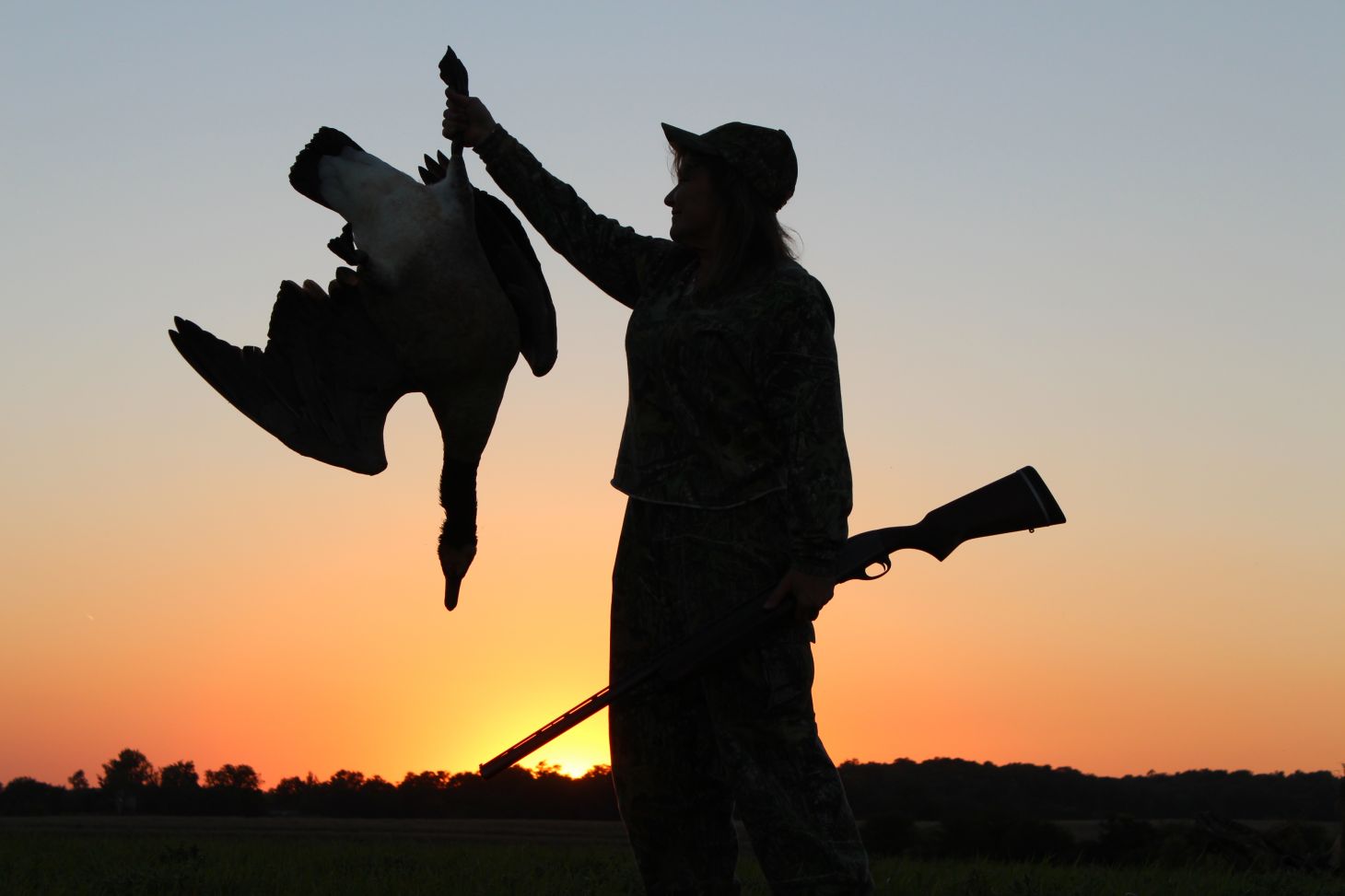 Hunter holds up Canada goose
