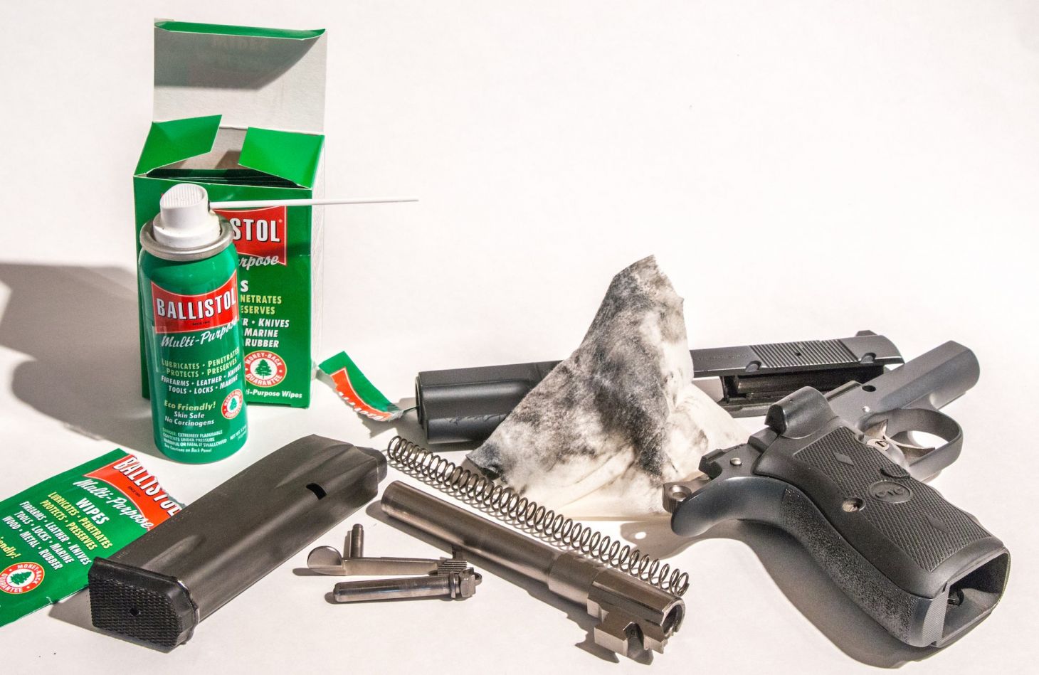 Handgun and cleaning supplies.