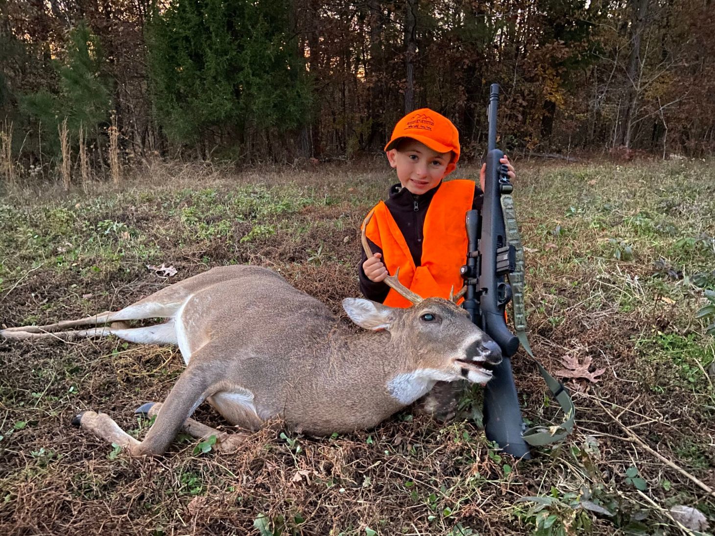 Author's son with a nice buck he took with 300 blackout ammo