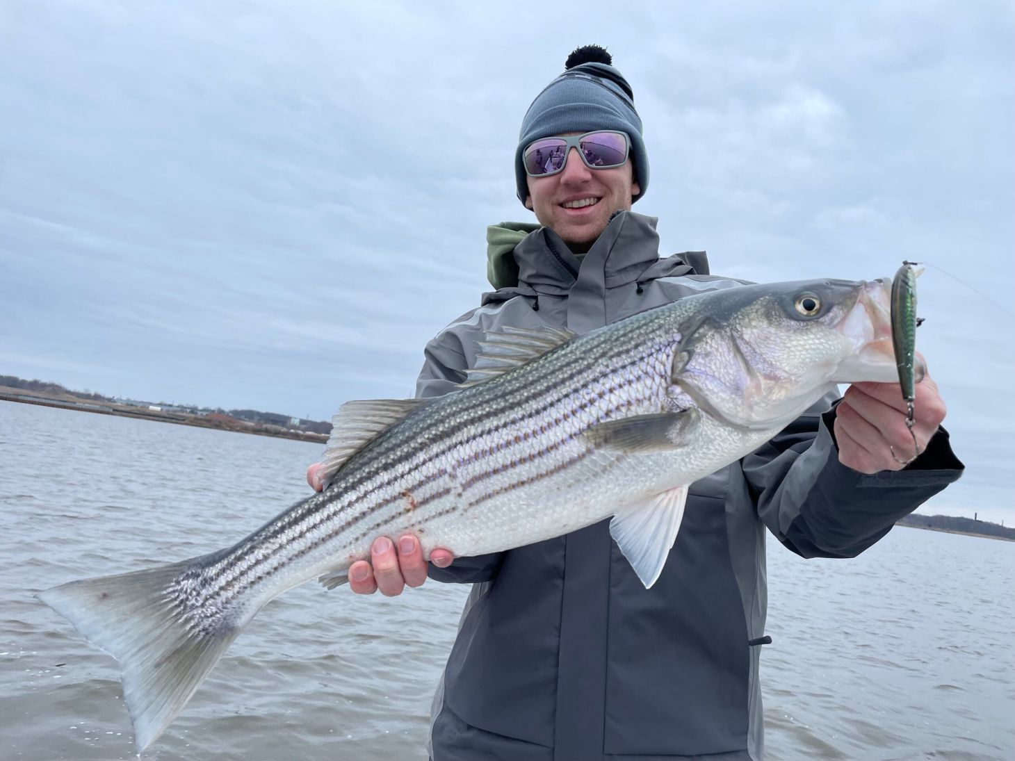 Field & Stream Senior Editor Ryan Chelius with 28-inch striped bass.