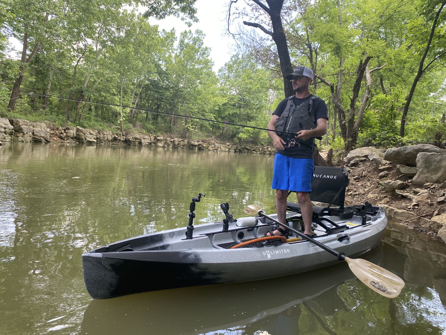 Fisherman standing in kayak