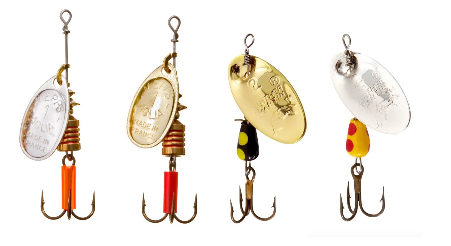 Two Mepp's Aglia spinners and two Panther Martin spinners on white background