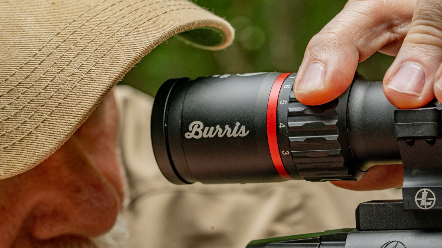 Shooter adjusting riflescope
