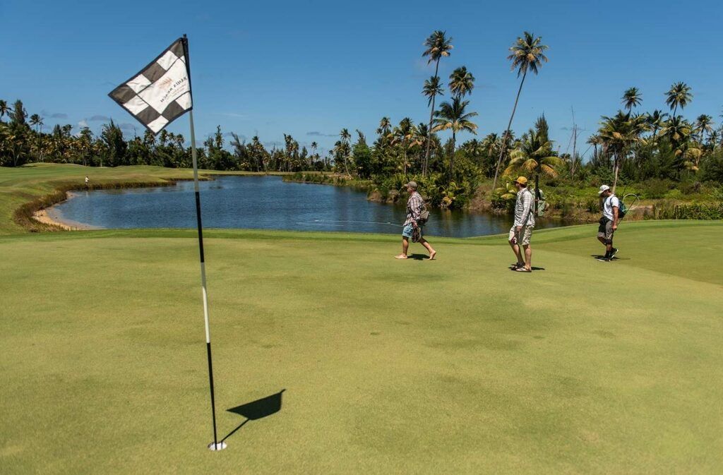 Anglers fishing on a golf course.