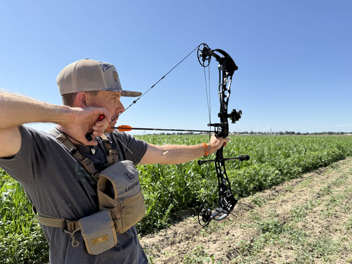 A archer shoots the new Bowtech Proven 34 on an outdoor range. 