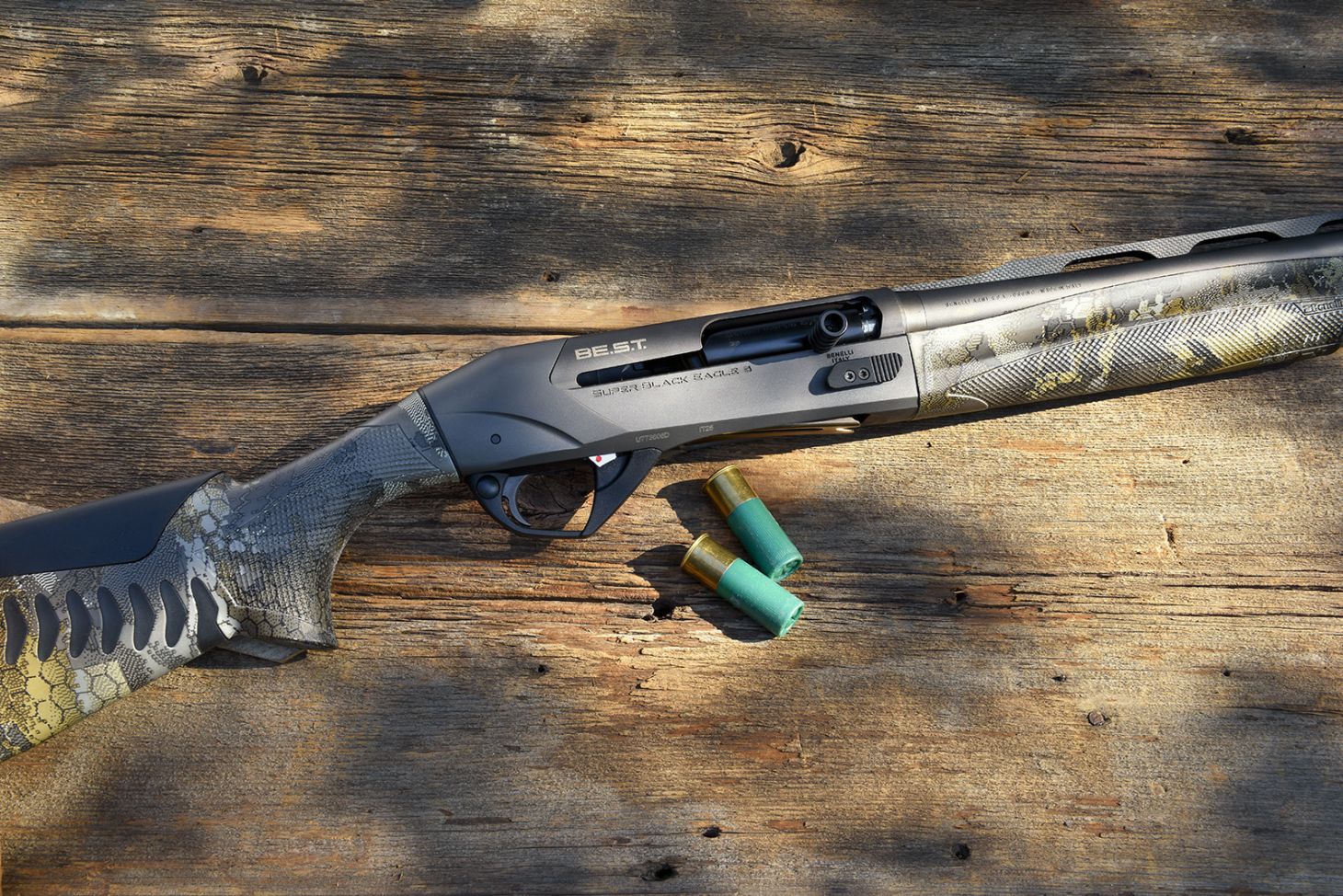 Closeup photo of Benelli SBE 3 A.I. BES.T. shogun on barn boards with shotgun shells. 