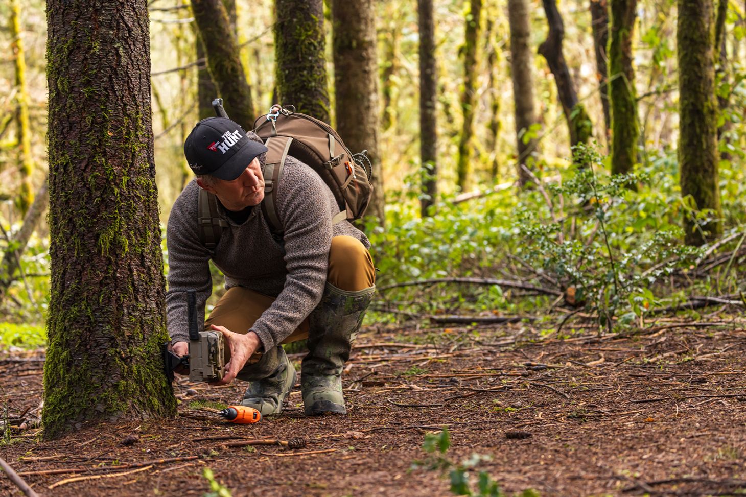Hunter setting trail camera