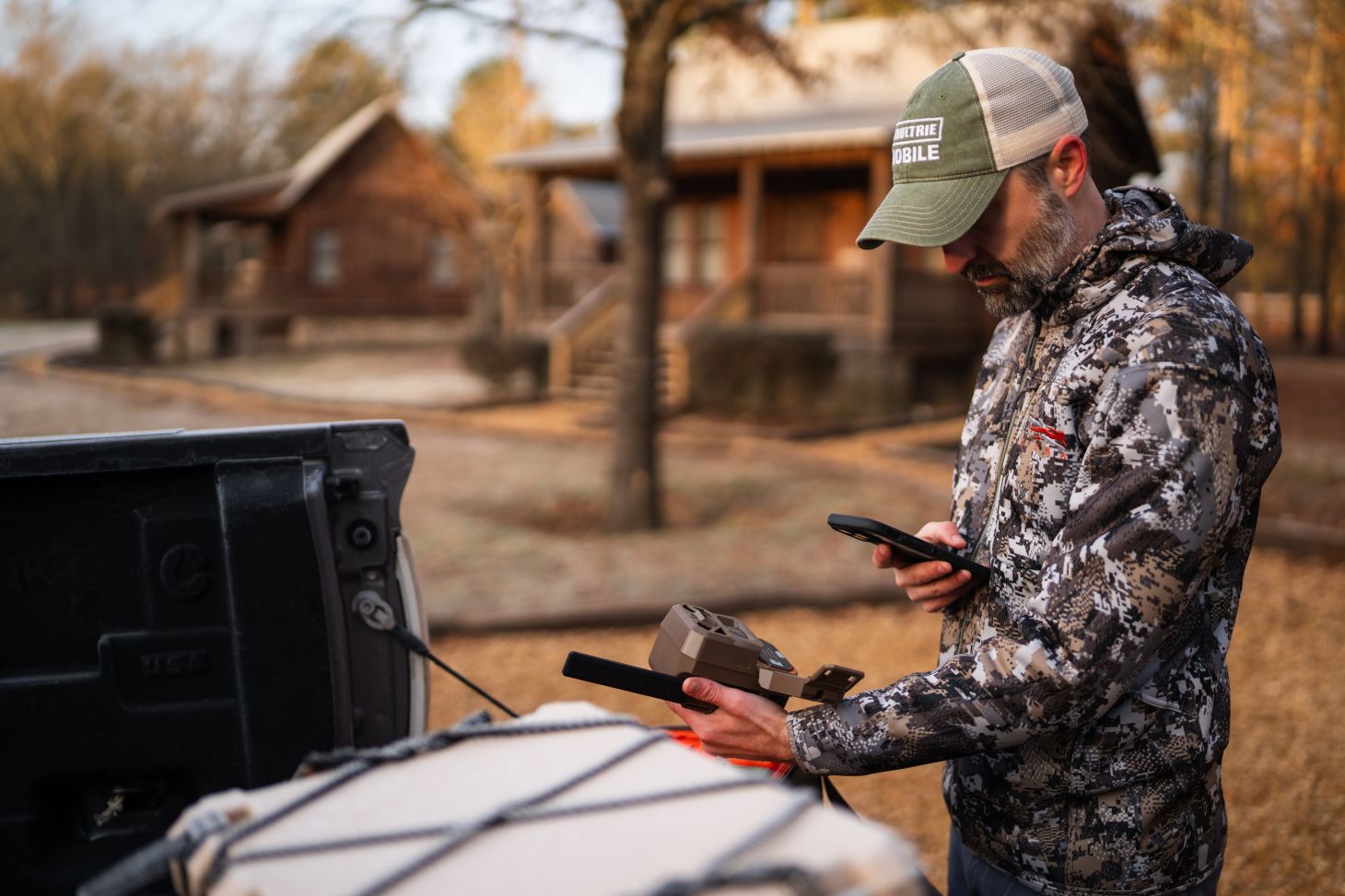 A hunter pair a Moultrie Mobile cellular call with his phone. 