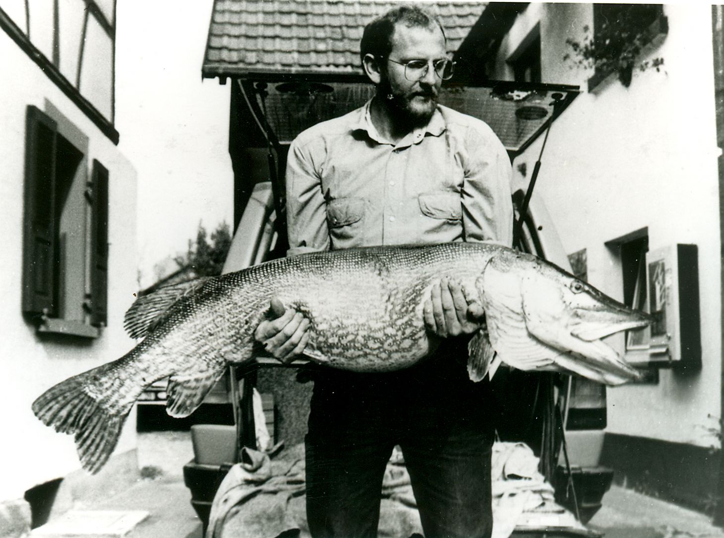An angler poses with a record-setting northern pike. 