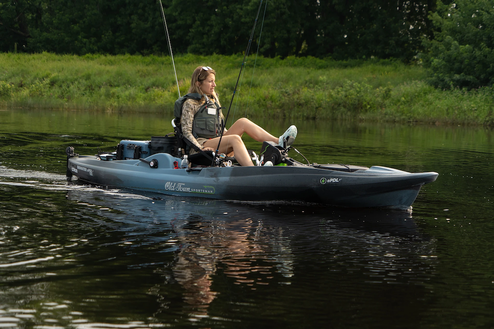 Female angler pedaling Old Town Sportsman BigWater ePDL+ 132 Fishing Kayak