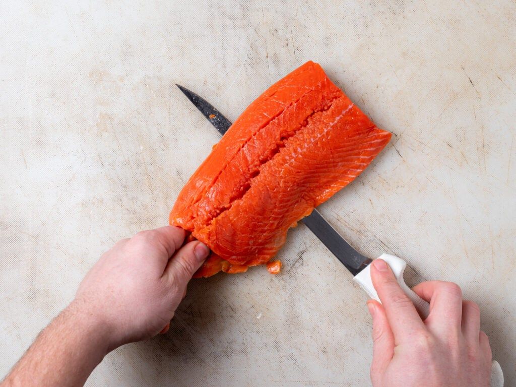 Fillet knife slicing through fish during testing