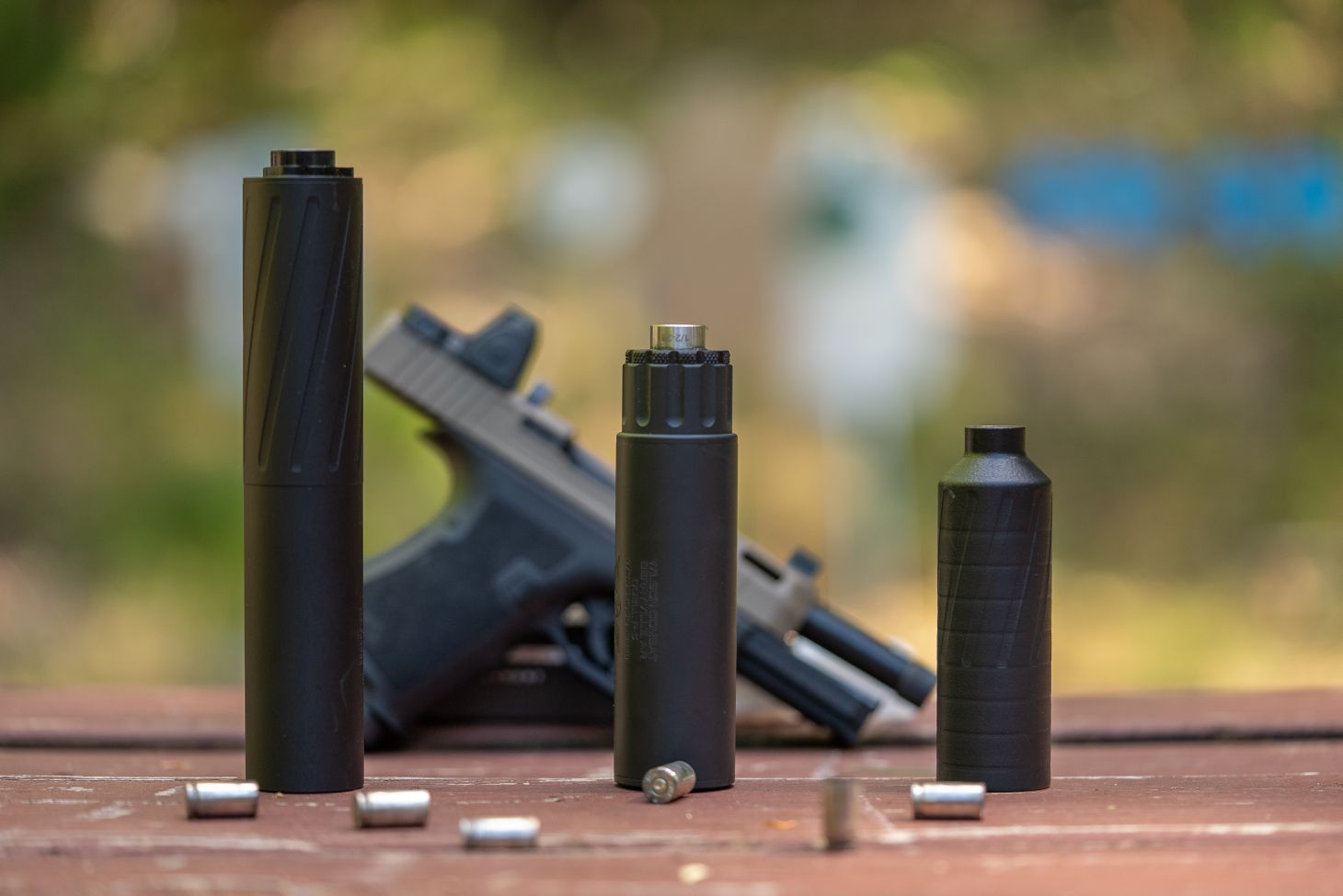 PD-THE PSA Dagger next to three different suppressors. 