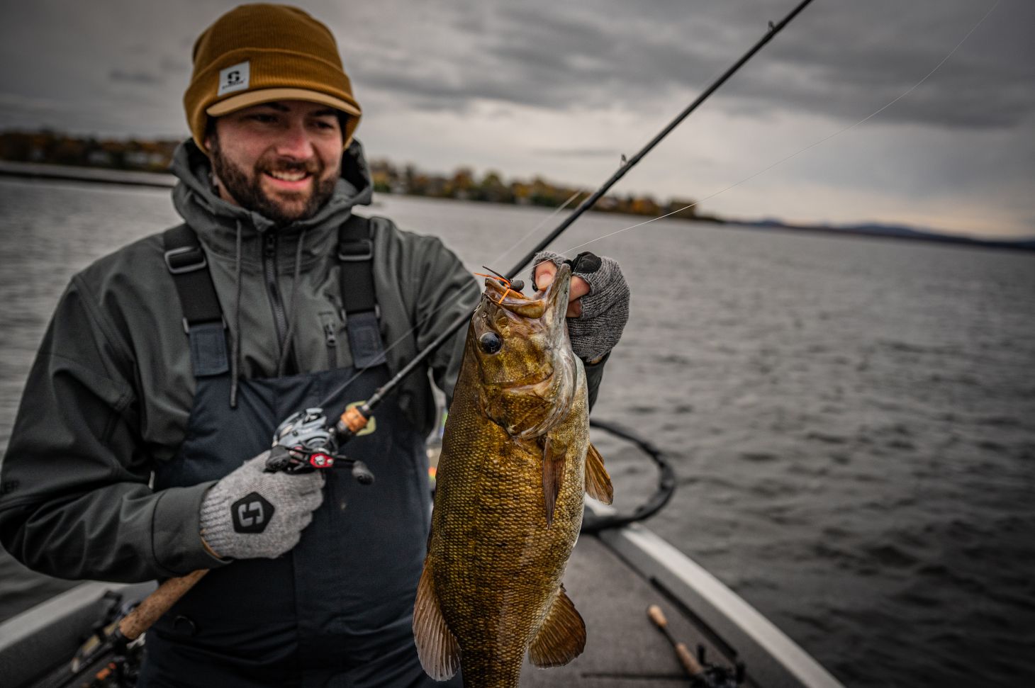 Angler holding up smallmouth bass