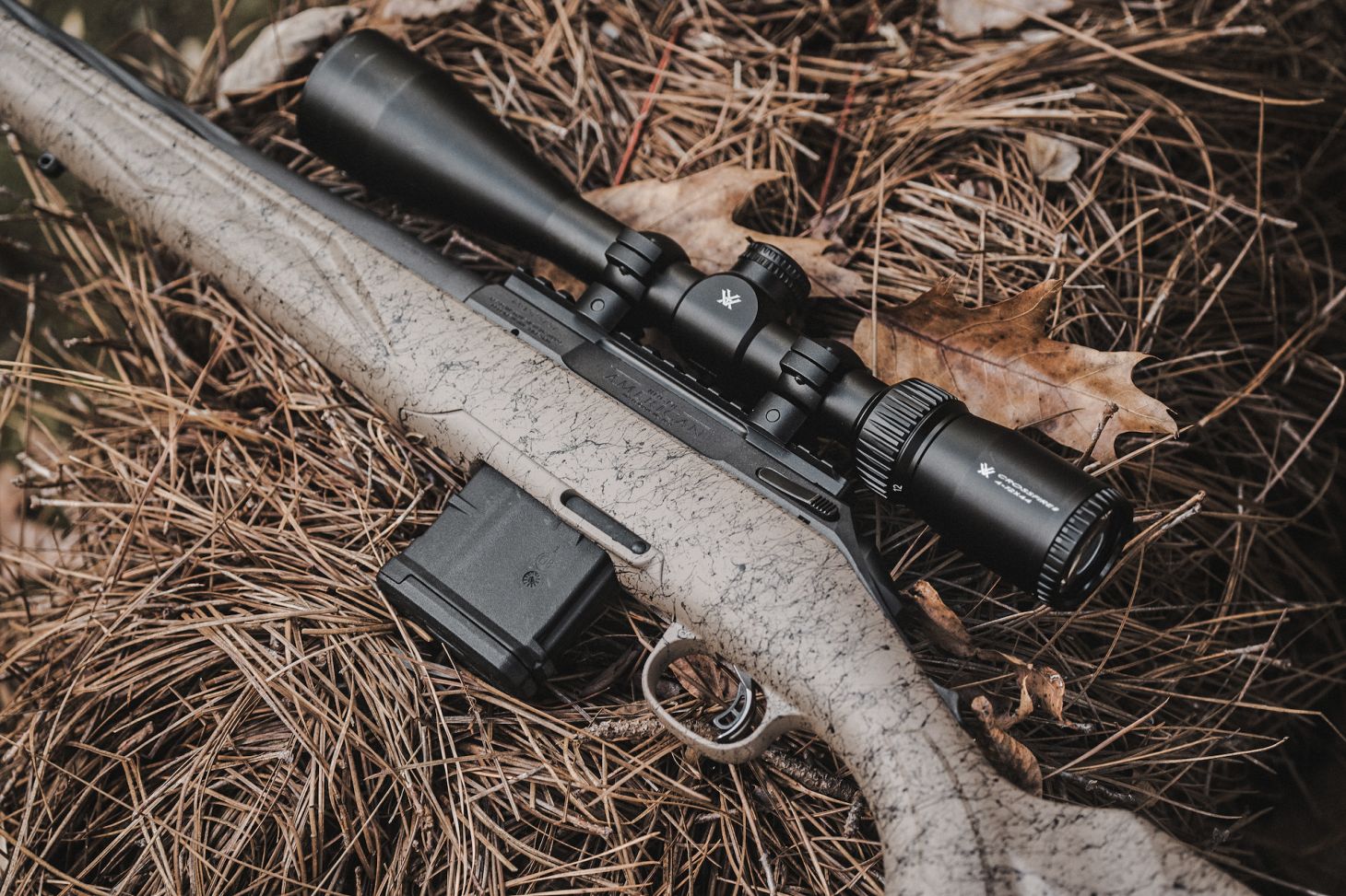 Ruger American Gen II Ranch rifle on pine needles.