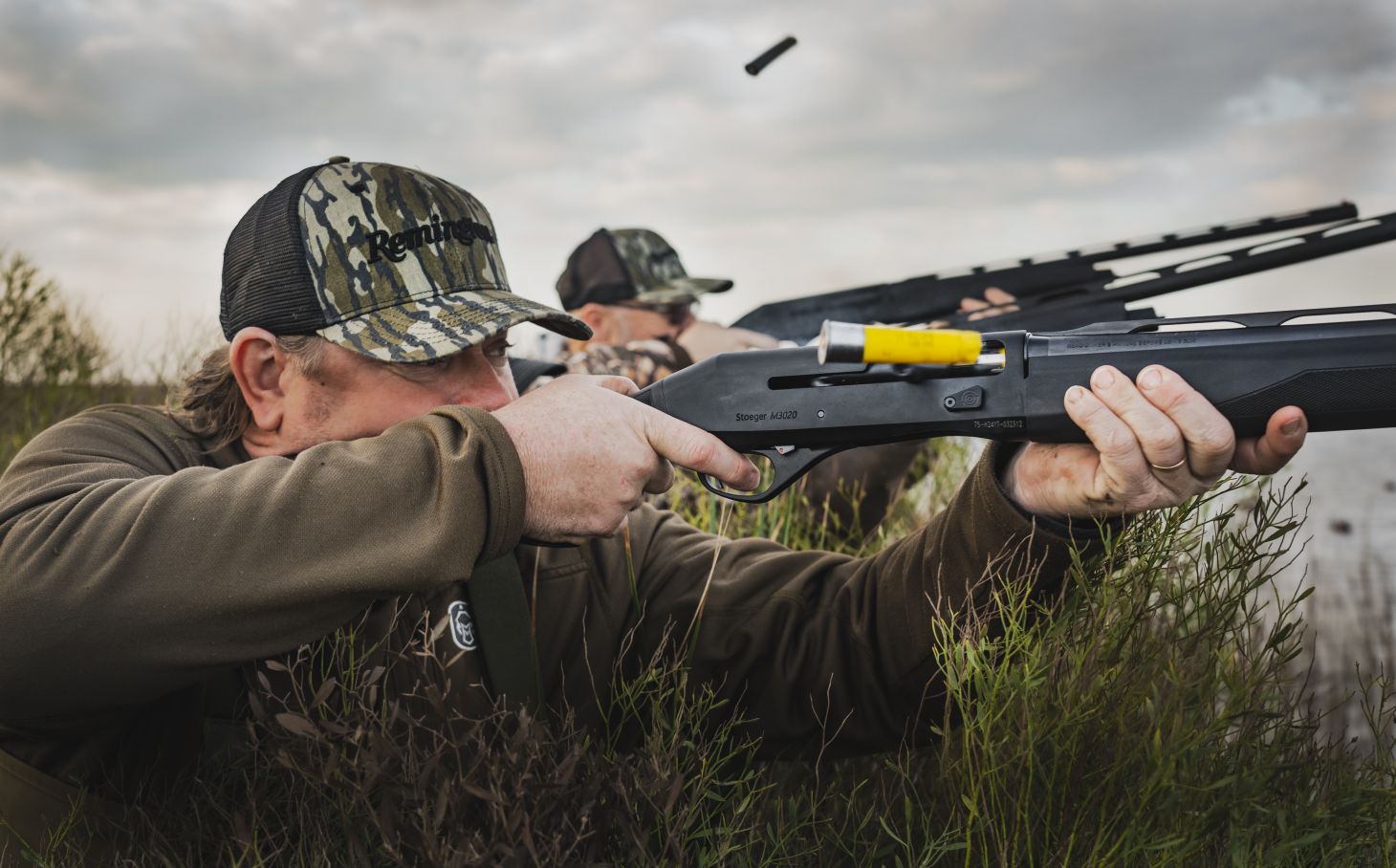 Hunters shooting shotguns