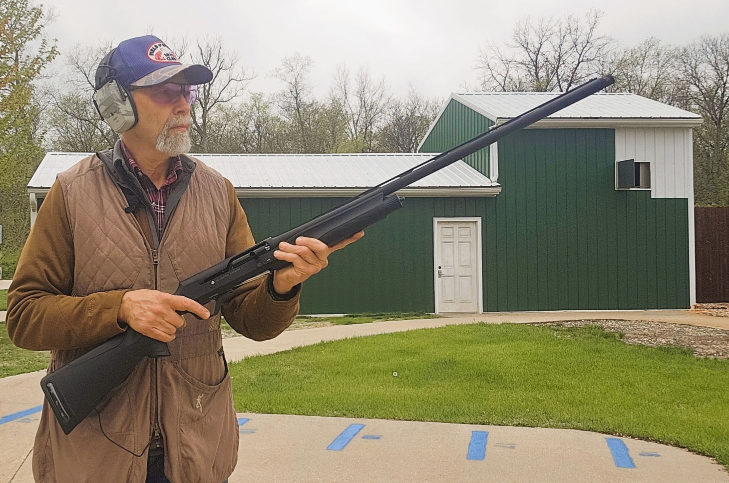 A shooter hold the new Retay ACE-R shotgun on a skeet range. 