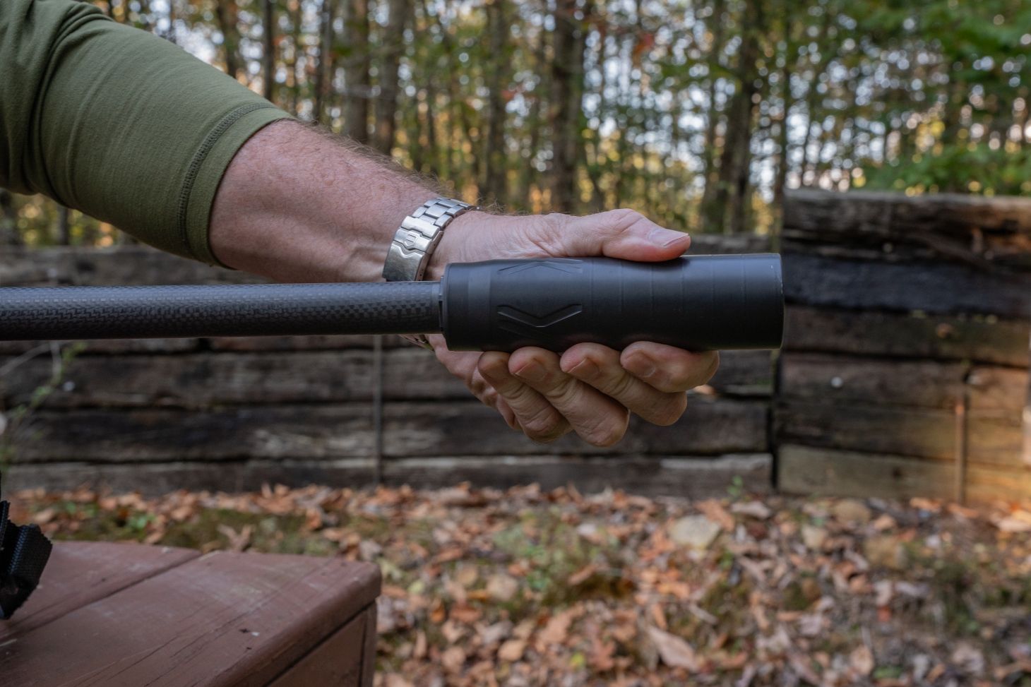 Hand holding suppressor 