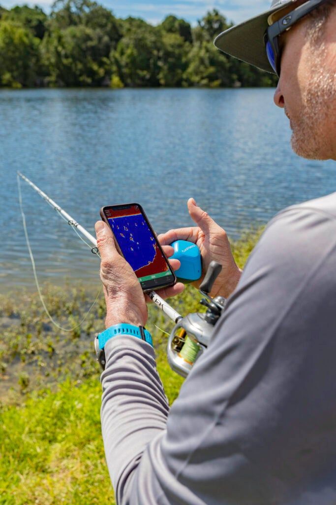 Angler using castable Garmin striker fish finder
