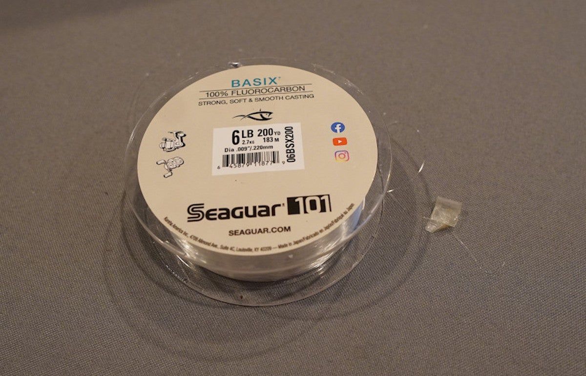 Seaguar Basix Fluorocarbon Fishing line spool sitting on table during testing