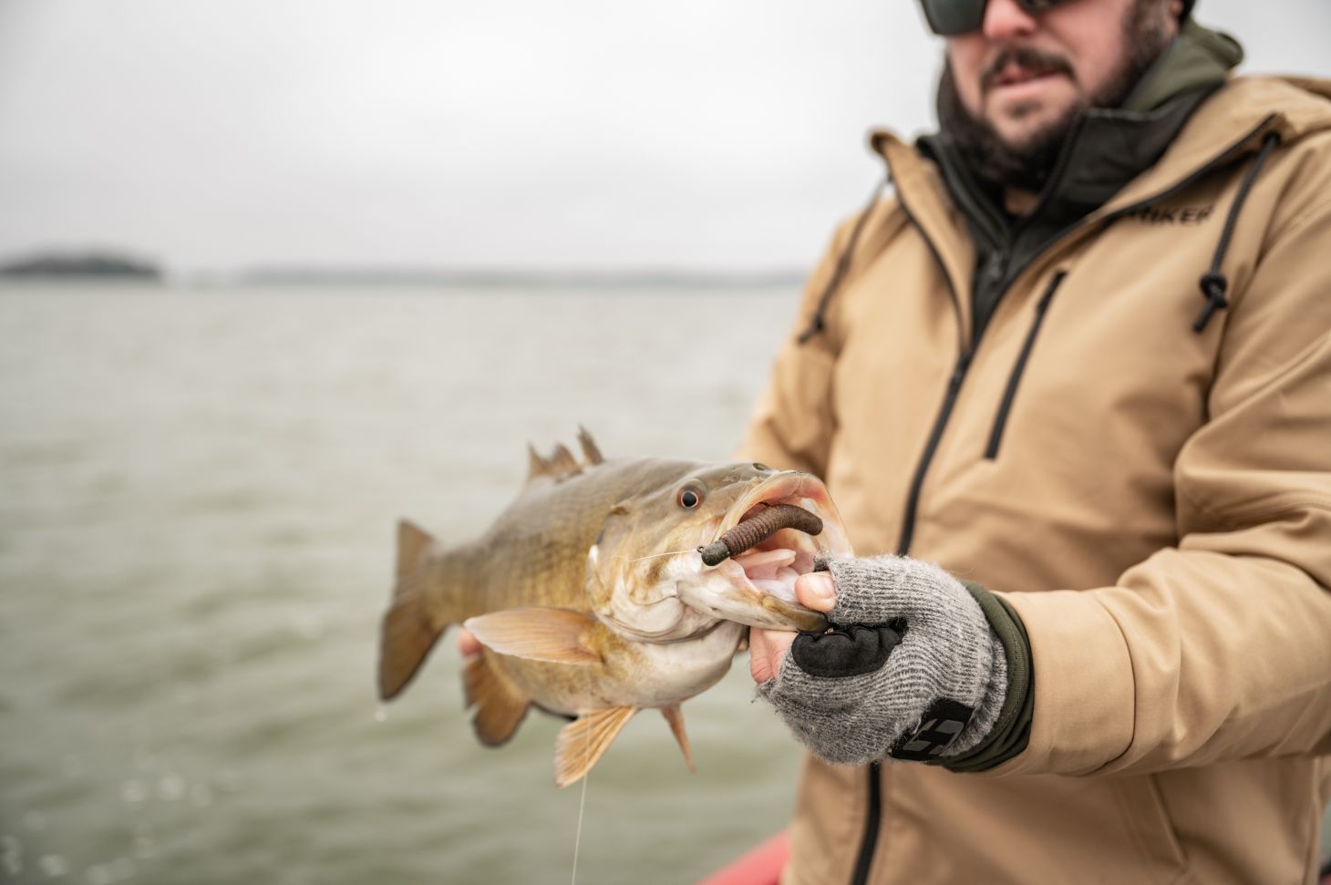 Angler holding smallmouth bass