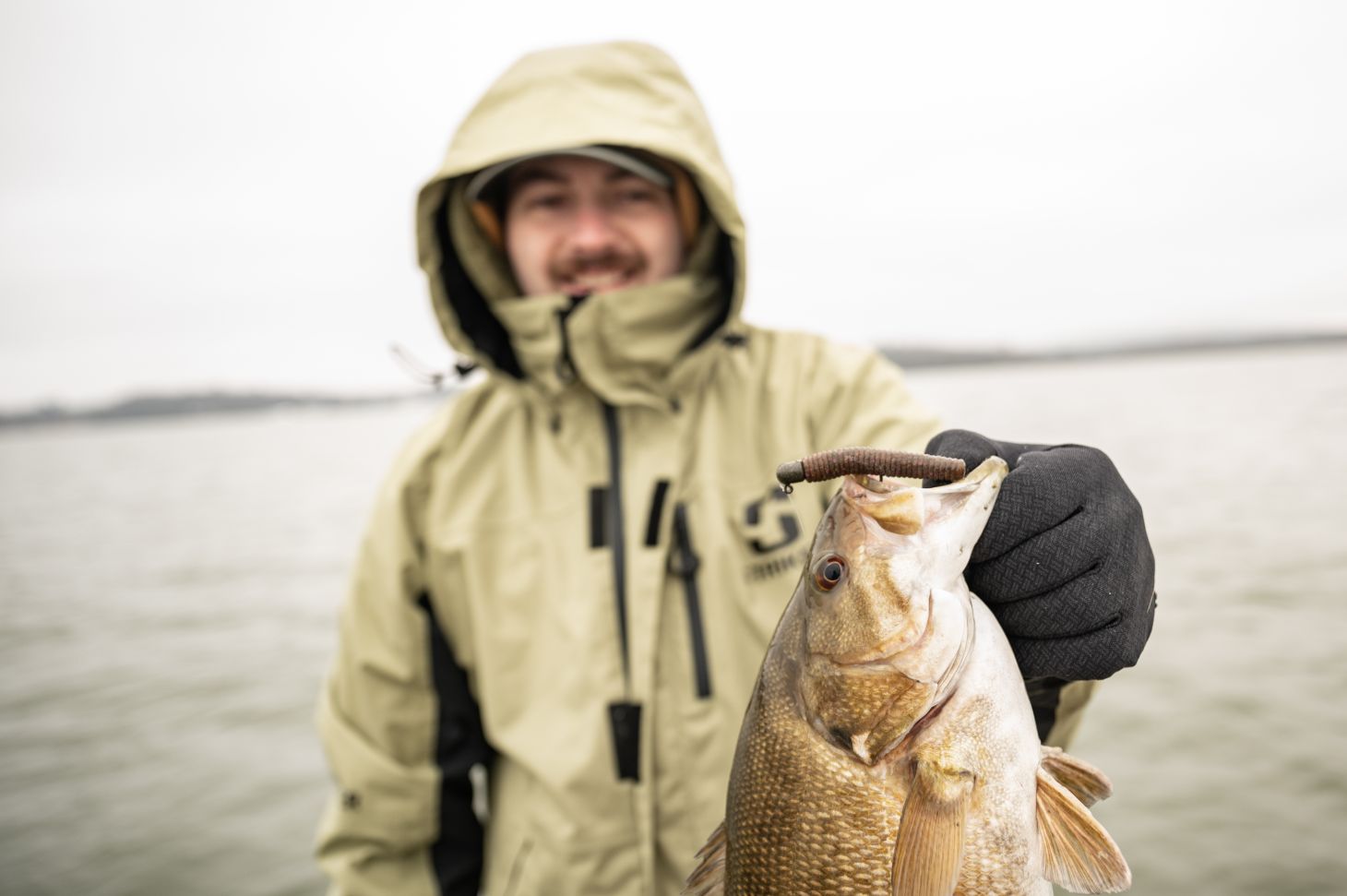 Angler holding up smallmouth bass