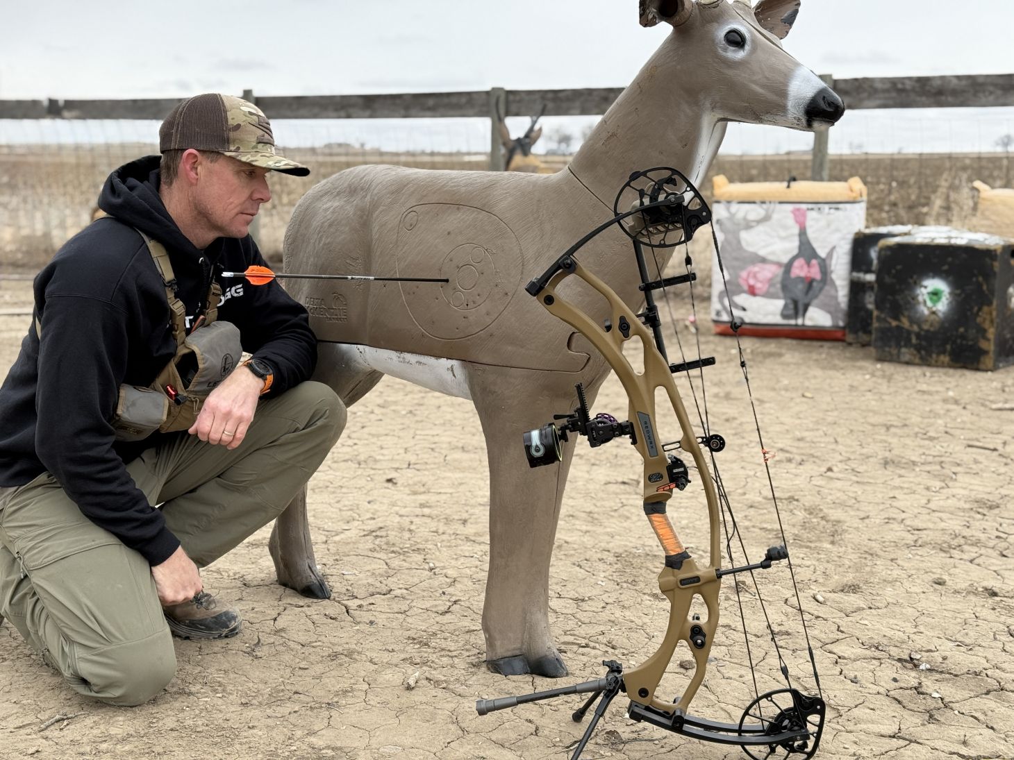 Archer standing next to deer target