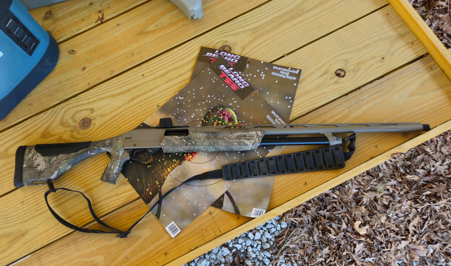 Shotgun on table with target