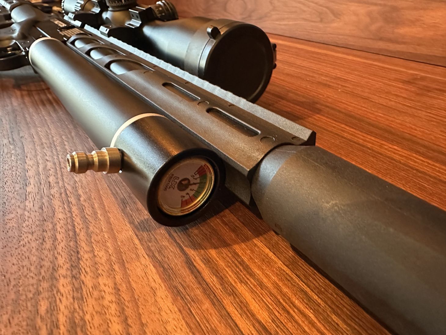 The air tank and barrel on an airgun