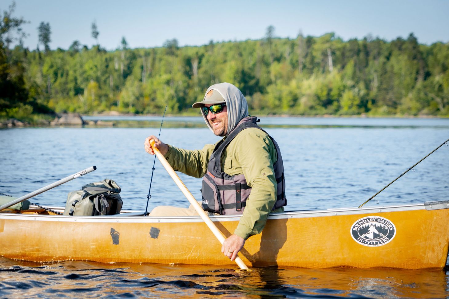 An angler paddles a canoe in the Boundary Waters of northern Minnesota. 
