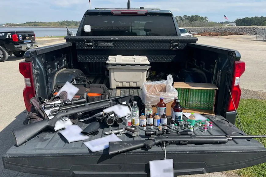 Tranquilizer guns, darts, and drugs seized during a deer smuggling bust in Texas.