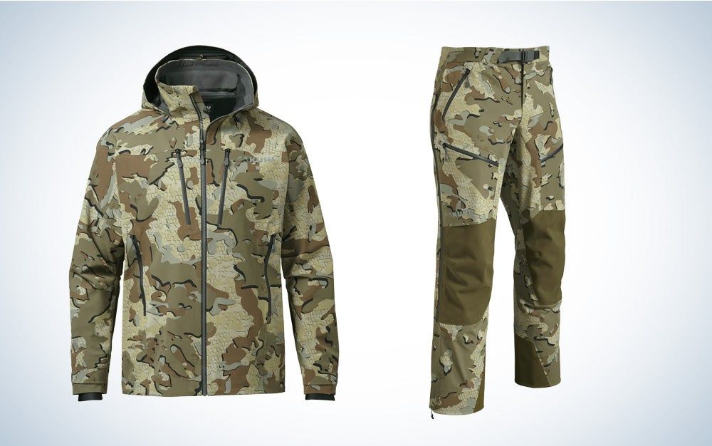 Kuiu's Yukon TR heavy-duty rain gear in Valo camo pattern on a black and white gradient background.
