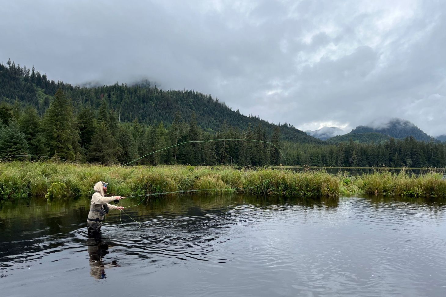 An fly fisherman in the Tongass National Forest in southeast Alaska. 