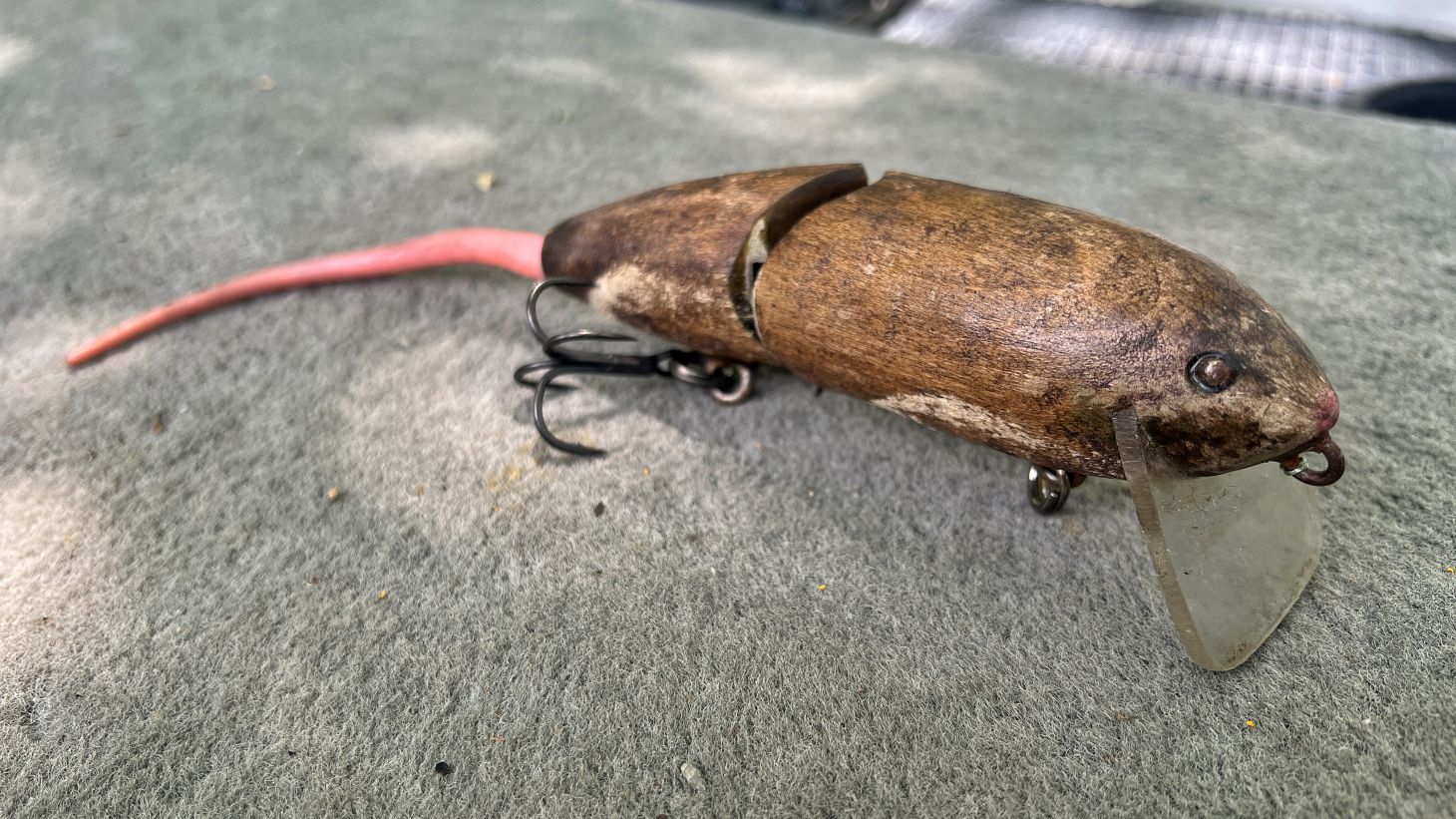 An old wooden mouse wakebait