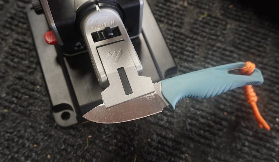 Work Sharp Professional Precision Adjust knife sharpener clamp on Benchmade knife during testing