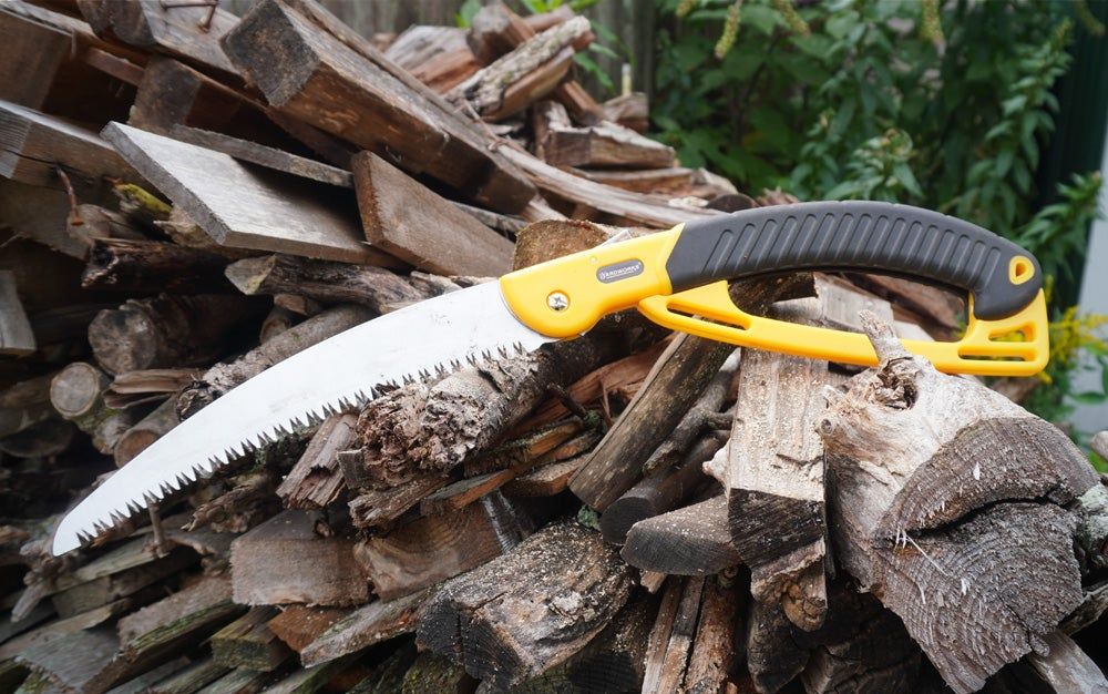 Yardworks 10-inch folding saw on log